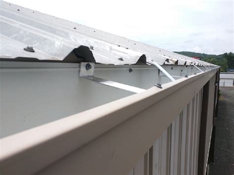 metal building gutter brackets|installing gutters on metal building.